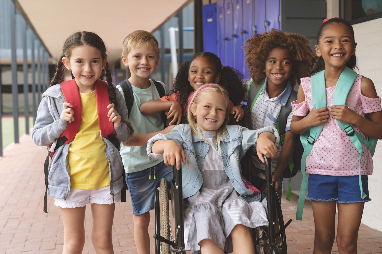 Children-Front,View,Of,Happy,Diverse,School,Kids,Standing,In,Outside